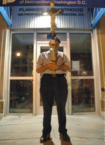 An anti-choice activist stands outside a Washington, D.C.-area clinic