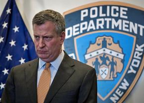 New York City Mayor Bill de Blasio speaks to reporters
