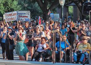 Protesters rally outside the Capitol building in Austin, Texas, to demand universal health care